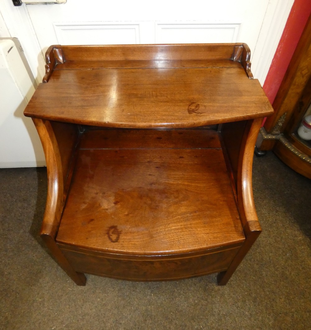 An antique Georgian mahogany bedside commode featuring an open upper shelf section with curved sides and a veneered lower cabinet. View III