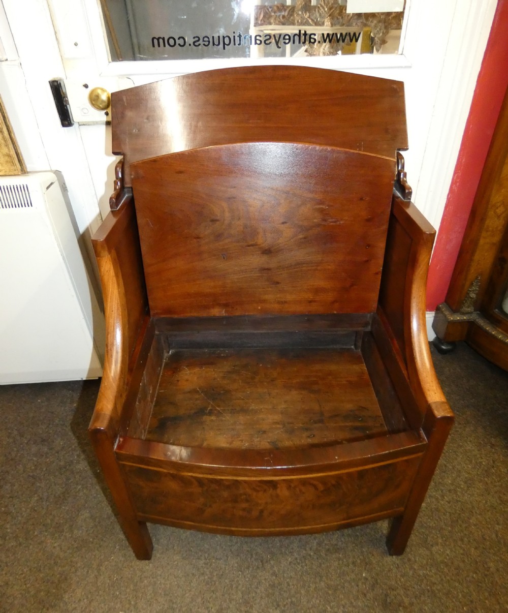 An antique Georgian mahogany bedside commode featuring an open upper shelf section with curved sides and a veneered lower cabinet. View VIII
