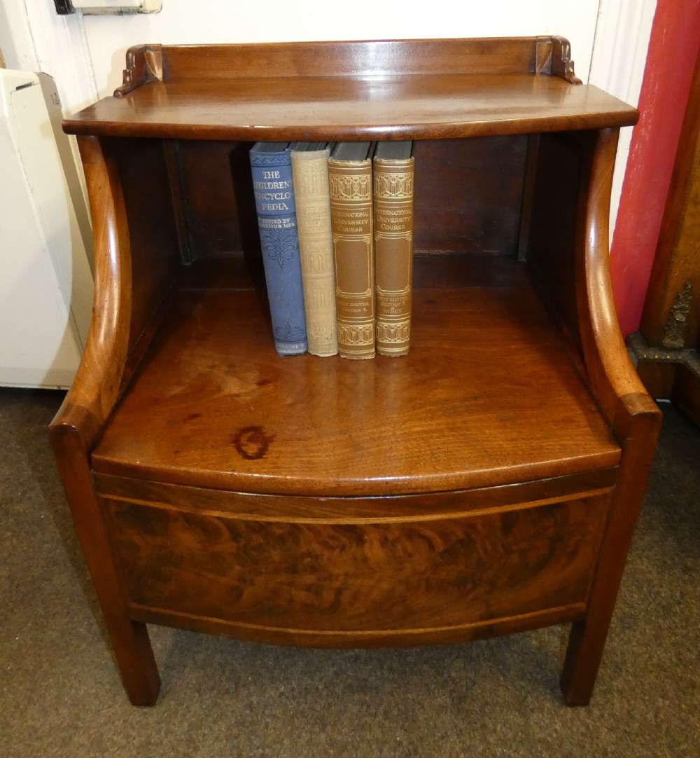 An antique Georgian mahogany bedside commode featuring an open upper shelf section with curved sides and a veneered lower cabinet. View IX