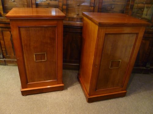 fig 2. A pair of antique mahogany collectors cabinets featuring numerous shallow drawers with turned wooden knobs, brass label holders, and hinged side doors.