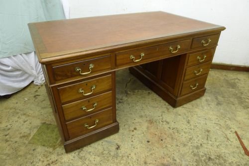 A Late Victorian English Walnut Pedestal Desk