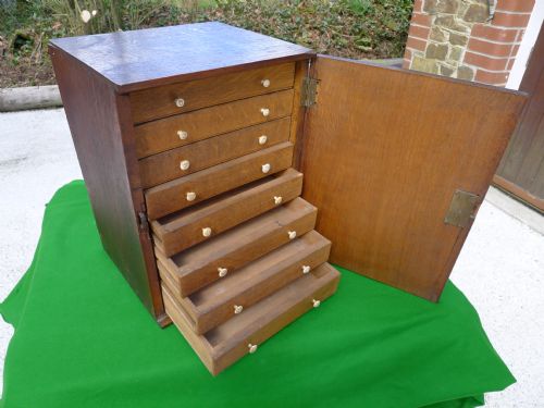 A Small Oak Collectors Cabinet Circa 1820