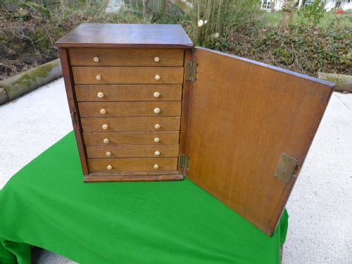 fig 1. A SMALL OAK COLLECTORS CABINET CIRCA 1820