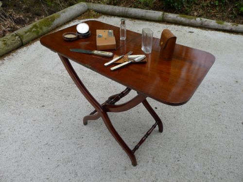 fig 1. A SUPERB VICTORIAN MAHOGANY FOLDING CAMPAIGN TABLE WITH TURNED AND SHAPED LEGS CIRCA 1860