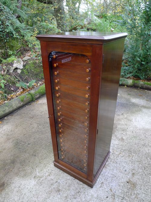A 20 Drawer Satin Walnut and Mahogany Collectors Cabinet by Messrs Watkins and Doncaster of the Strand, London. W. Circa 1890.