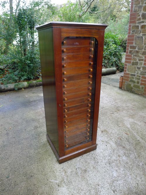 fig 1. A 20 DRAWER SATIN WALNUT AND MAHOGANY COLLECTORS CABINET BY MESSRS WATKINS AND DONCASTER OF THE STRAND, LONDON. W. CIRCA 1890.