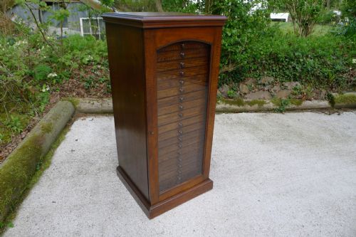 fig 1. AN OAK 20 DRAWER COLLECTORS CABINET BY JANSEN OF LONDON CIRCA 1900.