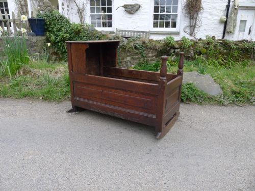 An 18th Century West Country Oak Rocking Cradle or Crib, Circa 1750