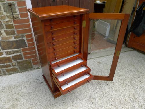 A Victorian Mahogany Collectors Cabinet by T.j.crockett of Cavendish Square. London. Circa 1890.