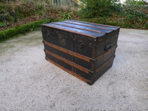 A Good Wood and Brass Bound Steamer or Cabin Trunk on Casters Circa 1890