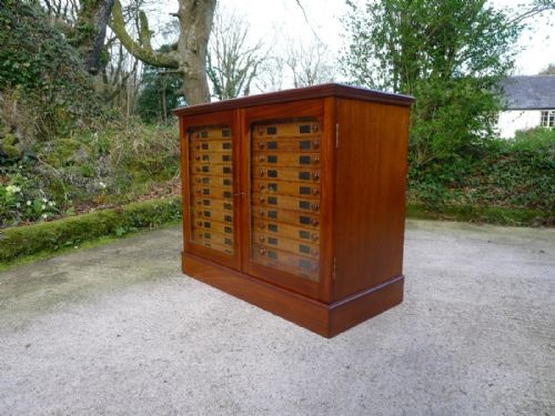 fig 3. A 24 DRAWER MAHOGANY COLLECTORS CABINET BY WATKINS AND DONCASTER OF LONDON. CIRCA 1900.