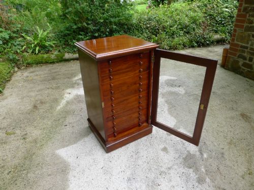 fig 1. A FINE 12 DRAWER HONDURAS MAHOGANY COLLECTORS CABINET BY MESSRS WATKINS AND DONCASTER. THE STRAND. LONDON. CIRCA 1890