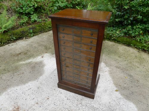 fig 2. A 12 DRAWER COLLECTORS CABINET IN STAINED AND POLISHED DEAL BY GARDNER OF OXFORD STREET. LONDON. CIRCA 1890.