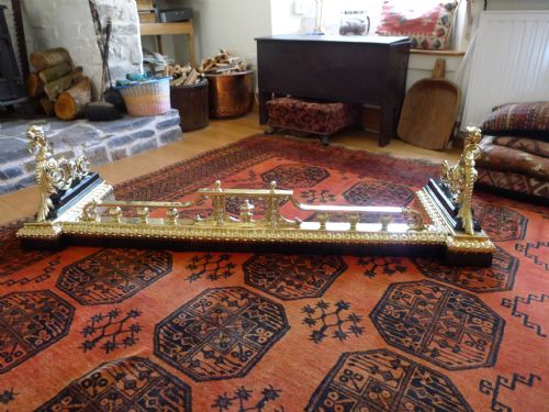 fig 1. A MAGNIFICANT MID 19th CENTURY BRASS AND IRON FIRE FENDER OR CURB.