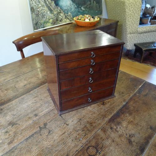 A Beautiful Table Top Collectors Cabinet in Georgian Mahogany. Circa 1810.