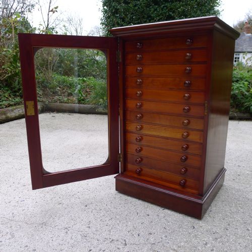 A Pristine Watkins & Doncaster 'De-luxe' Collectors Cabinet in Solid Mahogany. Circa 1890.