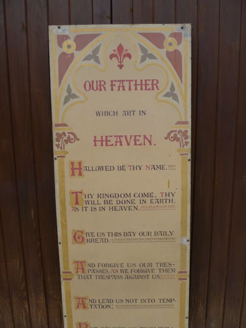 A SUPERB WALL MOUNTING ILLUMINATED RELIGIOUS TEXT FROM A TIN TABERNACLE CIRCA 1890