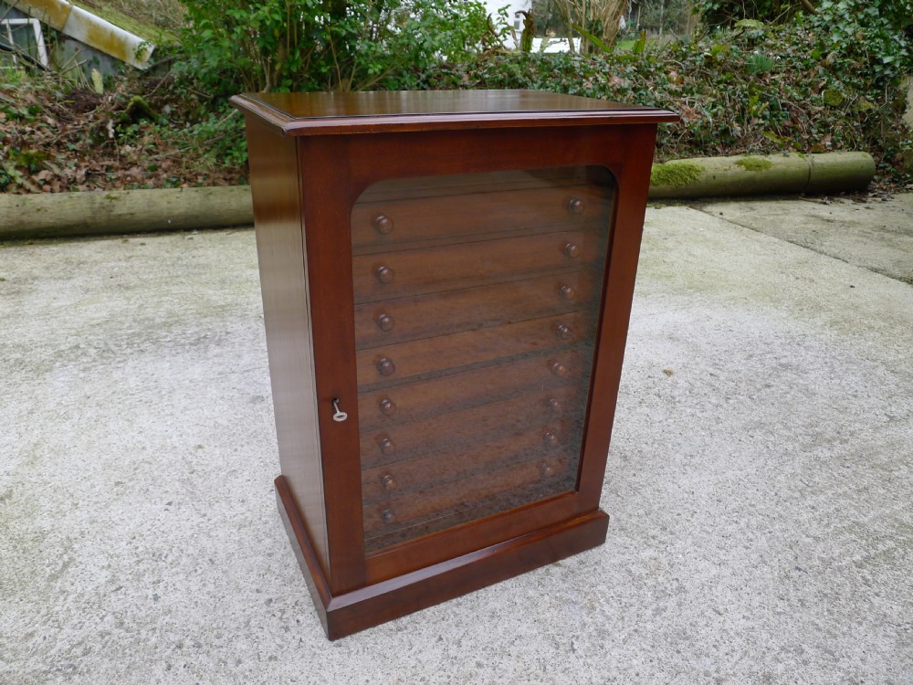 A GOOD VICTORIAN DEAL AND MAHOGANY COLLECTORS CABINET BY GARDNER OF OXFORD STREET, LONDON. CIRCA 1890.