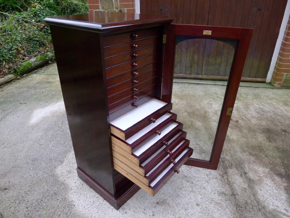 AN EXCELLENT 20 DRAWER COLLECTORS CABINET BY MESSRS WATKINS & DONCASTER, THE STRAND, LONDON.