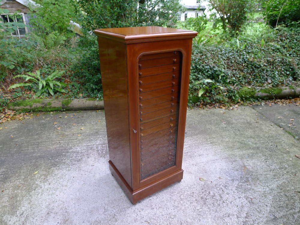 A TWENTY DRAWER COLLECTORS CABINET BY WATKINS & DONCASTER. CIRCA 1900.