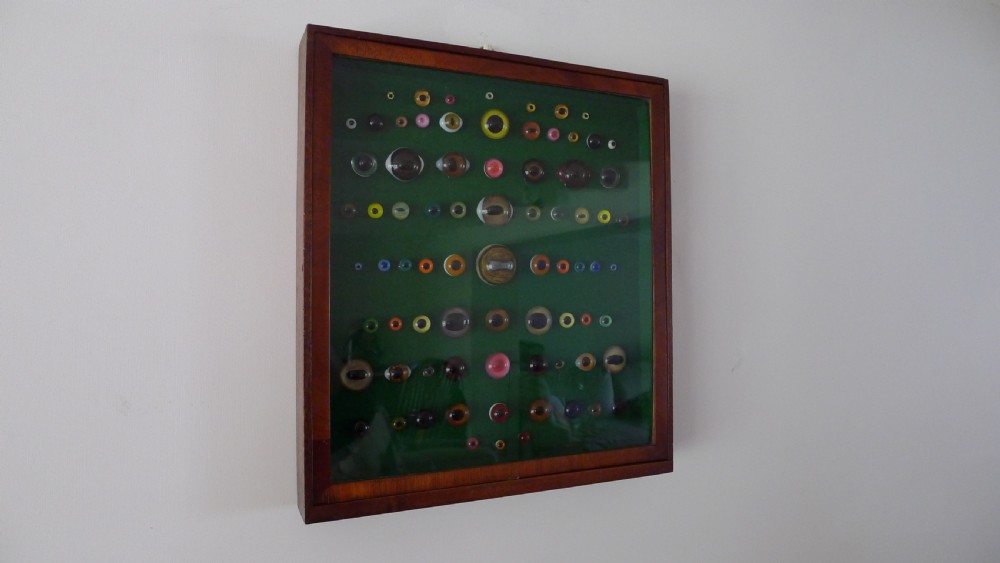 AN ANTIQUE WALL CASE CONTAINING A DISPLAY OF 77 VICTORIAN TAXIDERMY GLASS EYES. View III