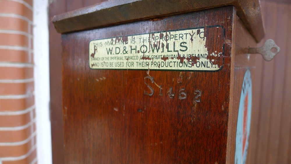 A 'WILD WOODBINE' CIGARETTE VENDING MACHINE IN FULL WORKING ORDER. CIRCA 1930. 3d A PACKET COMPLETE WITH OLD PENNIES!  View VII