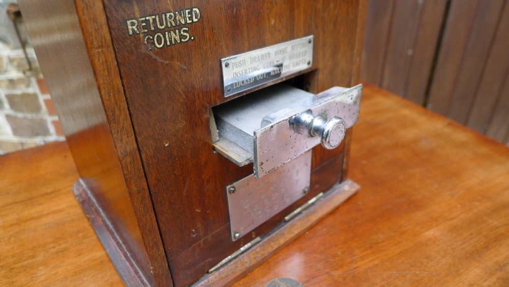 A 'WILD WOODBINE' CIGARETTE VENDING MACHINE IN FULL WORKING ORDER. CIRCA 1930. 3d A PACKET COMPLETE WITH OLD PENNIES!  View XII