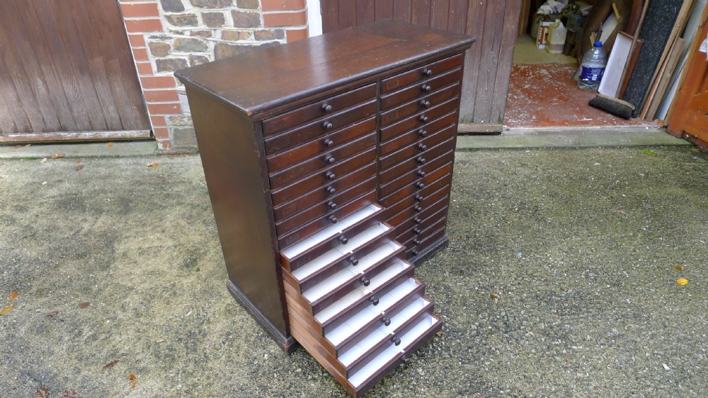 A VERY VERSATILE 30 DRAWER VICTORIAN COLLECTORS CABINET IN STAINED AND POLISHED DEAL. CIRCA 1890.
