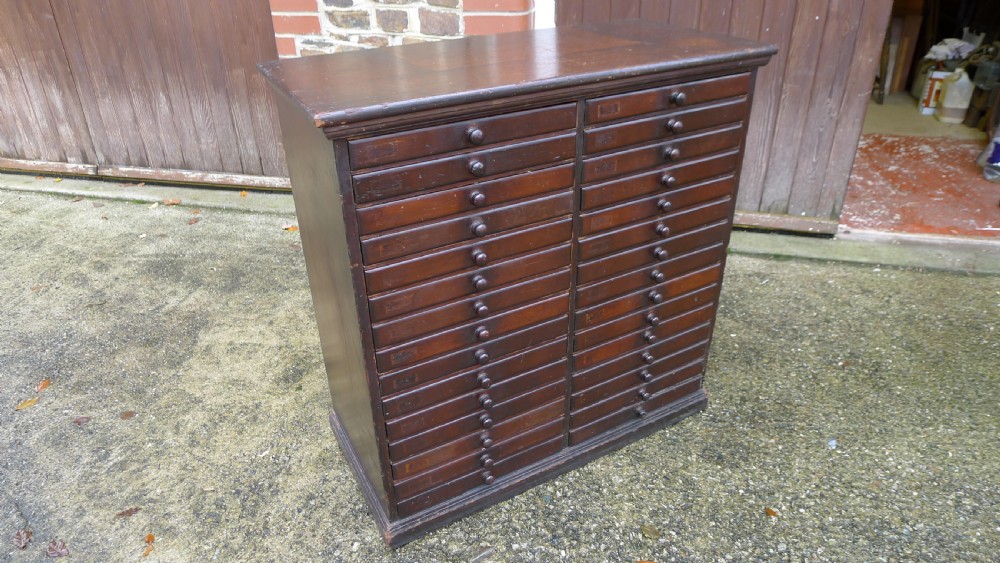 A VERY VERSATILE 30 DRAWER VICTORIAN COLLECTORS CABINET IN STAINED AND POLISHED DEAL. CIRCA 1890. View II