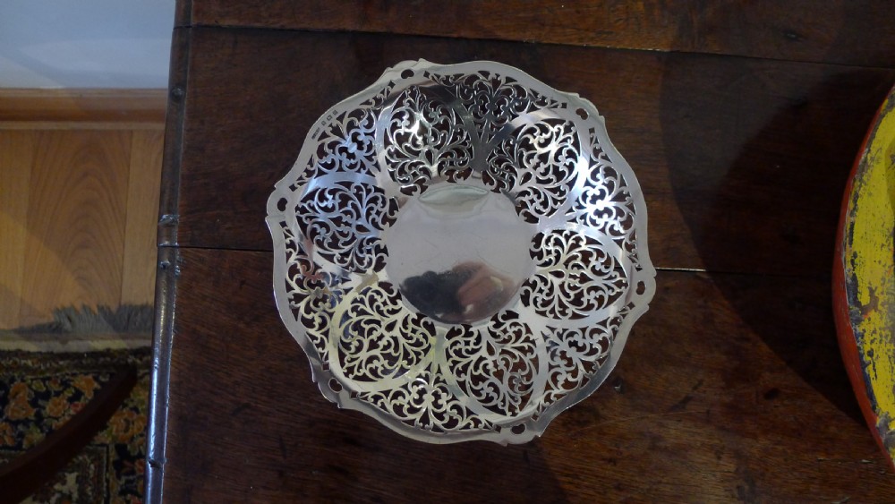 A PIERCED SILVER BON BON DISH BY S.J.LEVI BIRMINGHAM 1932.  View III