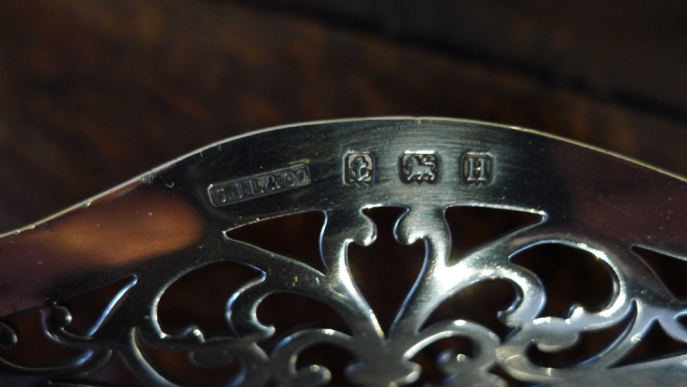 A PIERCED SILVER BON BON DISH BY S.J.LEVI BIRMINGHAM 1932.  View VIII
