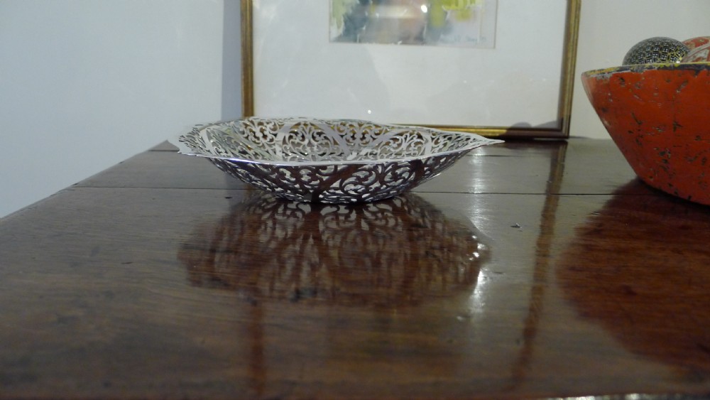 A PIERCED SILVER BON BON DISH BY S.J.LEVI BIRMINGHAM 1932.  View IX