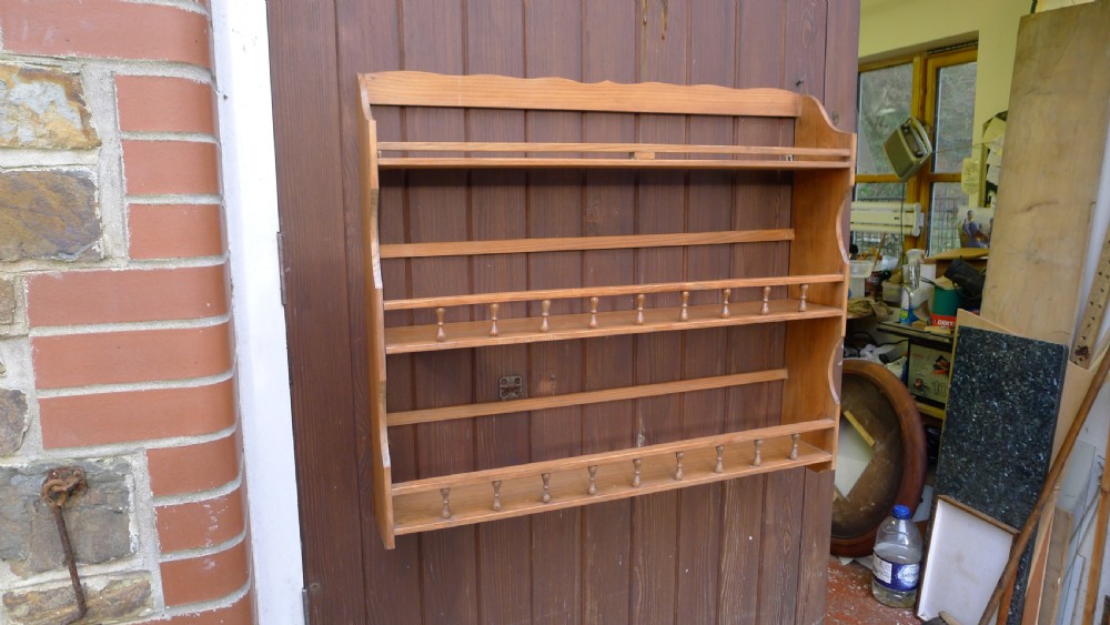A VICTORIAN DEAL HANGING BOOK SHELF OR DISPLAY RACK. CIRCA 1890. View III