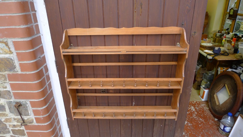 A VICTORIAN DEAL HANGING BOOK SHELF OR DISPLAY RACK. CIRCA 1890. View VIII