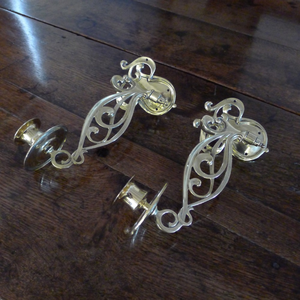 A BEAUTIFUL PAIR OF BRASS, SWING OUT PIANO CANDLE HOLDERS. CIRCA 1890.