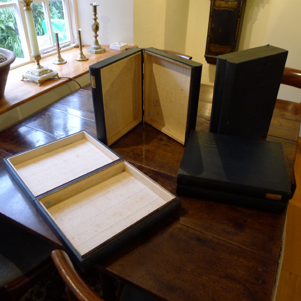 4 BUCKRAM BOUND 'BOOK' BOXES BY J.T.CROCKETT, CAVENDISH SQUARE, LONDON. CIRCA 1880.