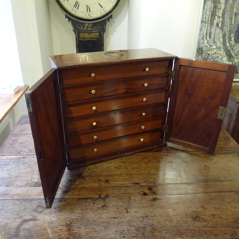 A GEORGE III MAHOGANY COLLECTORS CABINET. CIRCA 1790.