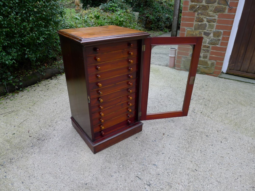 A GOOD 12 DRAWER DEAL AND MAHOGANY COLLECTORS CABINET BY WATKINS & DONCASTER. CIRCA 1890.