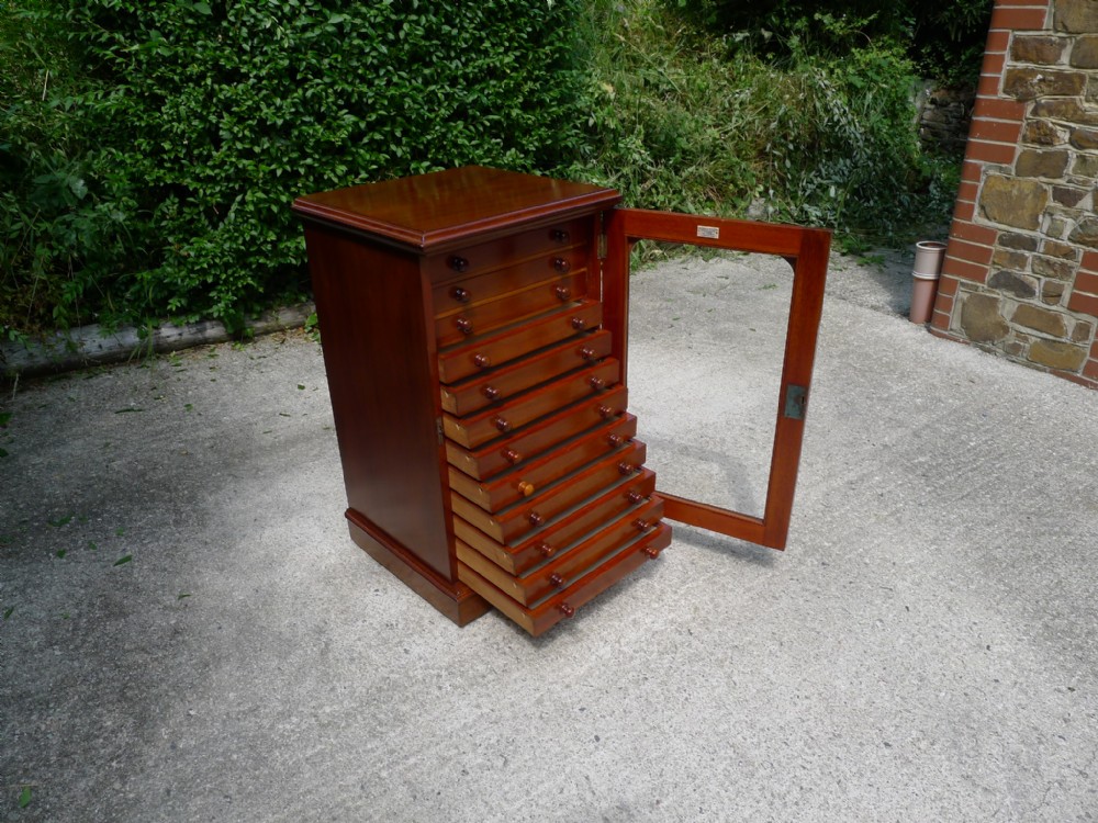 AN EXCEPTIONAL 12 DRAWER DE-LUXE COLLECTORS CABINET BY MESSRS WATKINS AND DONCASTER. CIRCA 1890.