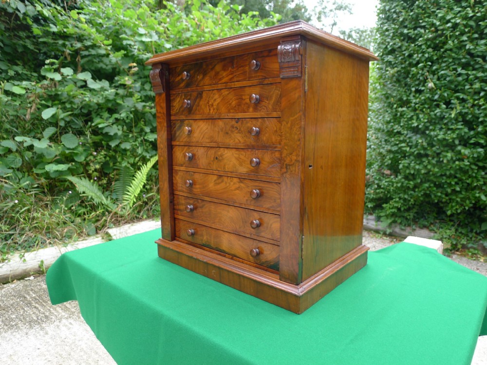 A VERY FINE ENGLISH BURR WALNUT WELLINGTON CHEST COLLECTORS CABINET. CIRCA 1870.