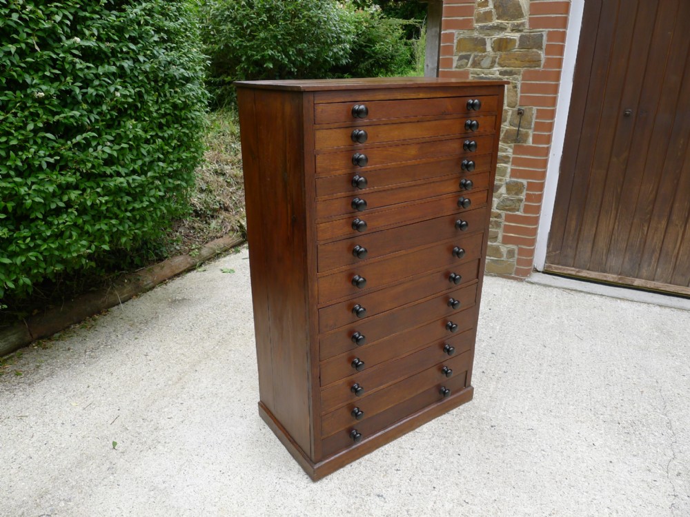 A 14 DRAWER EGG COLLECTORS CABINET IN OAK AND DEAL CIRCA 1890.