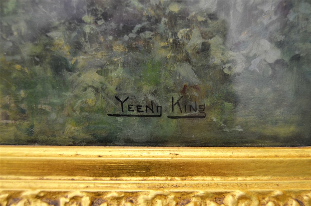 A Victorian oil painting depicting a woman seated beside a stream in a forested landscape, enclosed within an ornate carved gilt frame. View IV