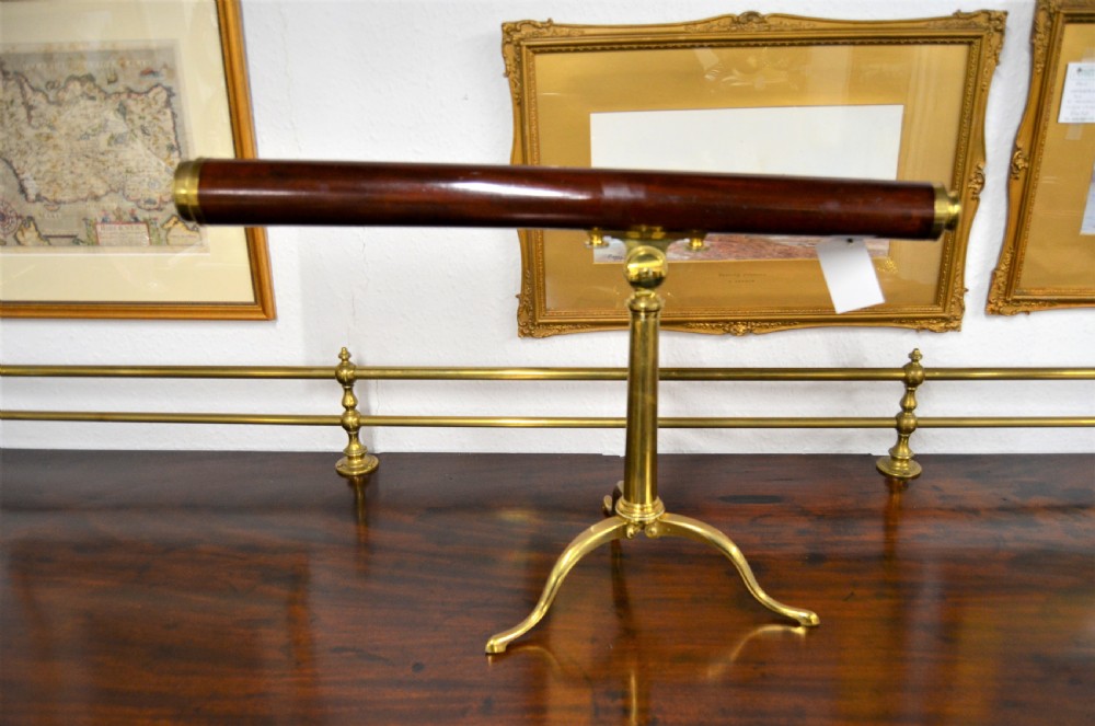An 18th-century mahogany and brass table telescope by G. Adams of London set on a brass tripod stand. View II