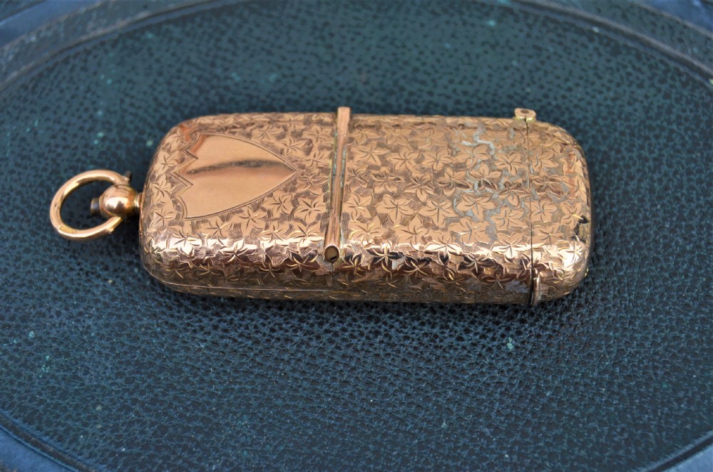 9ct gold sovereign & vesta case
