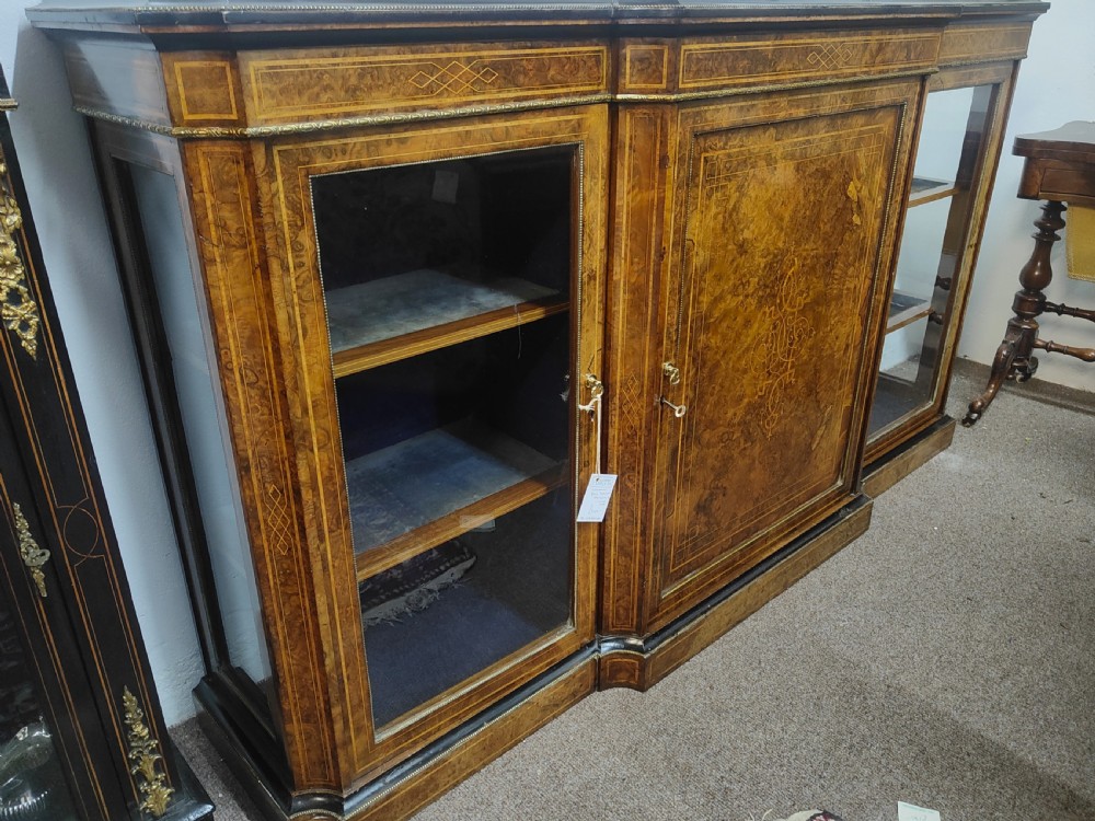 A Victorian burr walnut breakfront credenza featuring central marquetry inlay flanked by two glazed side cabinets. View III