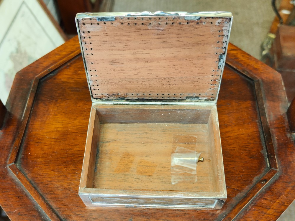 A rectangular late Victorian sterling silver cribbage box featuring a central glazed Queen of Hearts playing card surrounded by a pegboard border. View III