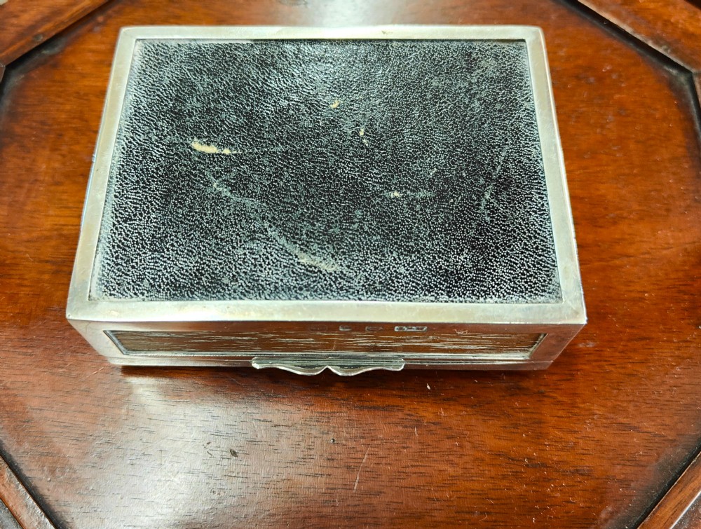 A rectangular late Victorian sterling silver cribbage box featuring a central glazed Queen of Hearts playing card surrounded by a pegboard border. View VII