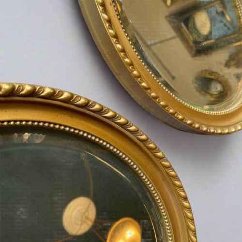 PAIR OF GILT OVAL MIRRORS CIRCA 1910 - ADDITIONAL PHOTO 1