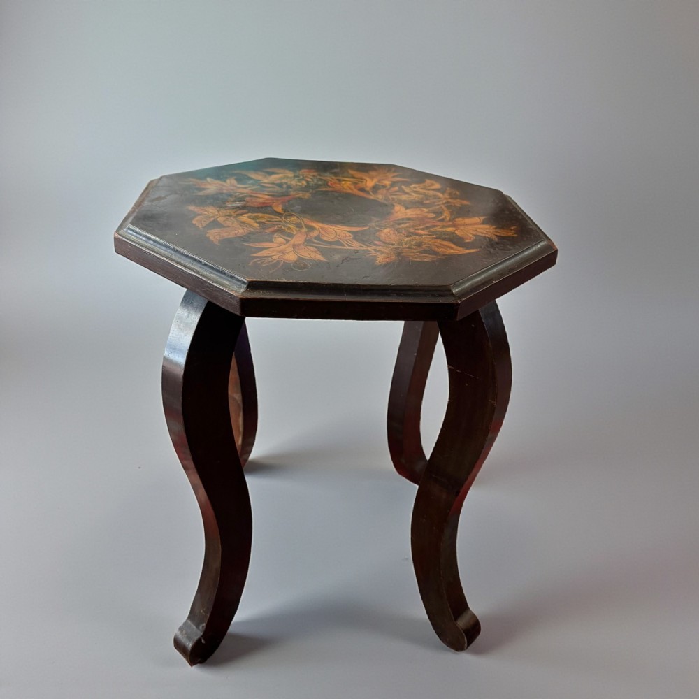 An early 20th-century octagonal side table featuring dark lacquer with intricate golden floral penwork on the top and slender cabriole legs. View II