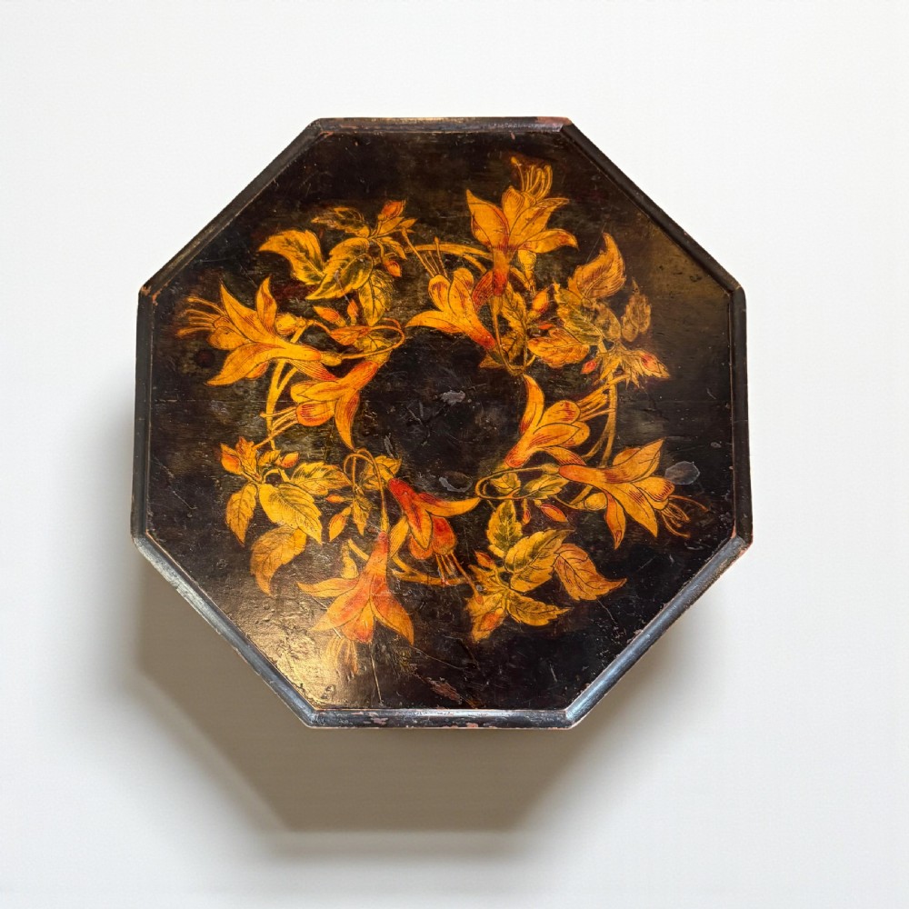 An early 20th-century octagonal side table featuring dark lacquer with intricate golden floral penwork on the top and slender cabriole legs. View III